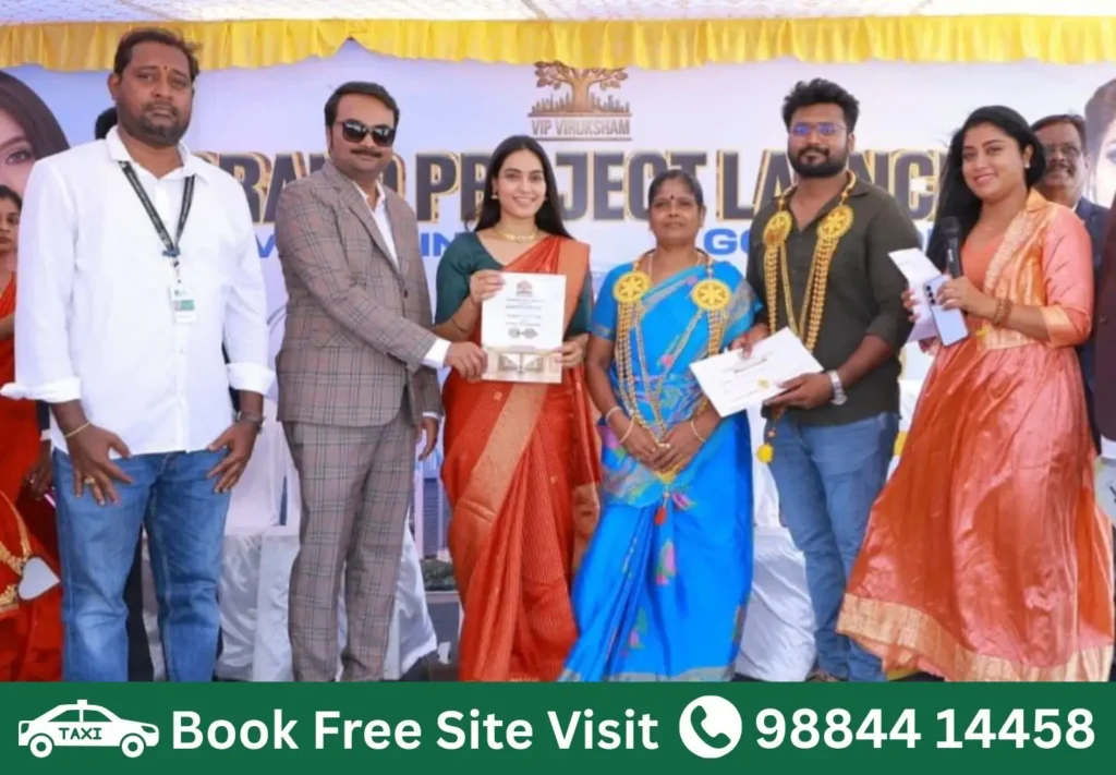 Happy customer receiving booking certificate at VIP Viruksham Singaperumal Koil DTCP approved villa plots project launch near Mahindra World City